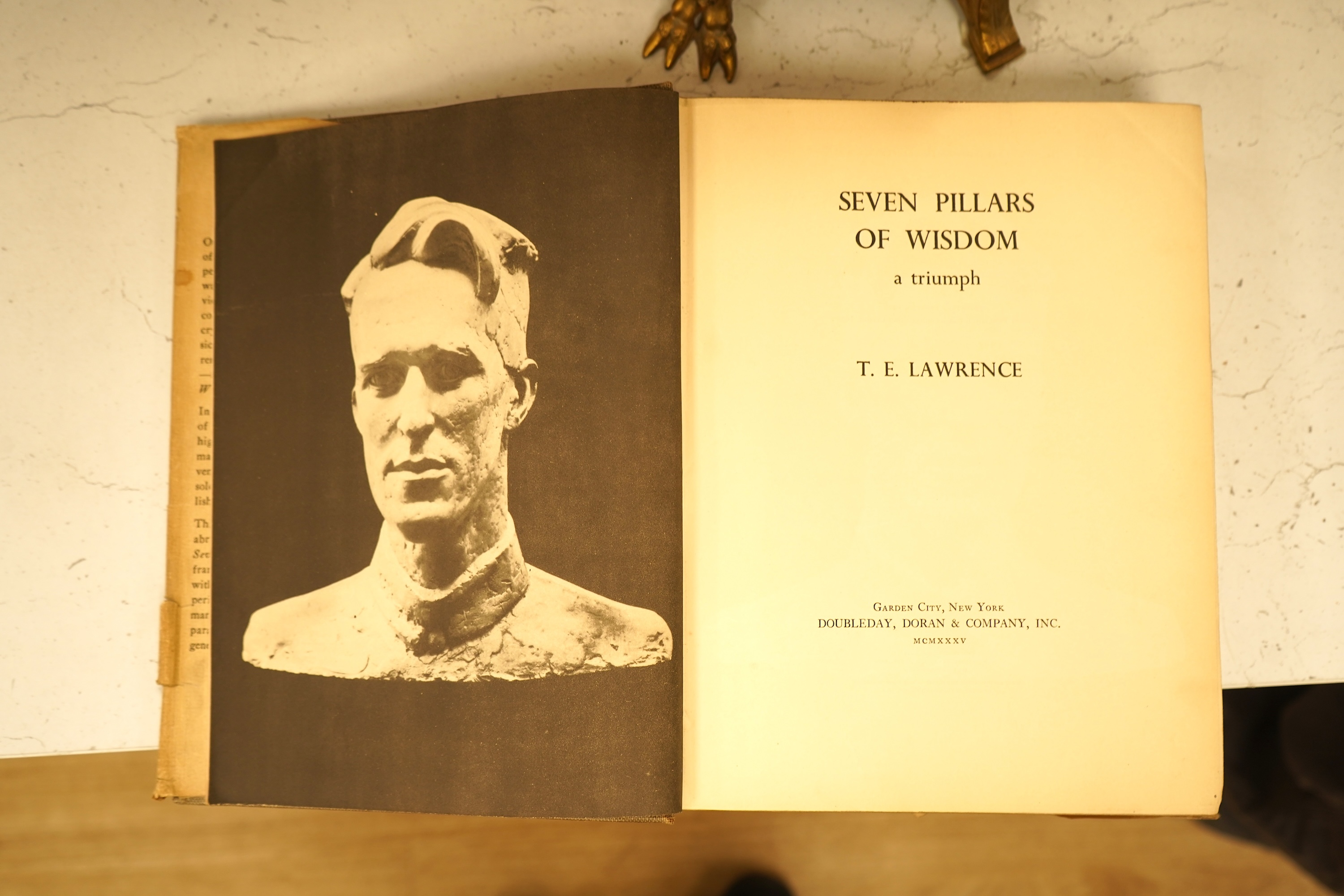 Lawrence, T.E. - Seven Pillars of Wisdom: a triumph. 1st US. trade edition. num. plates (many are portraits by Kennington and others), 6 text illus. and 4 maps (outline colour); publisher's gilt cloth and d/wrapper, roy.